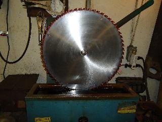 saw blade polished and being dipped
